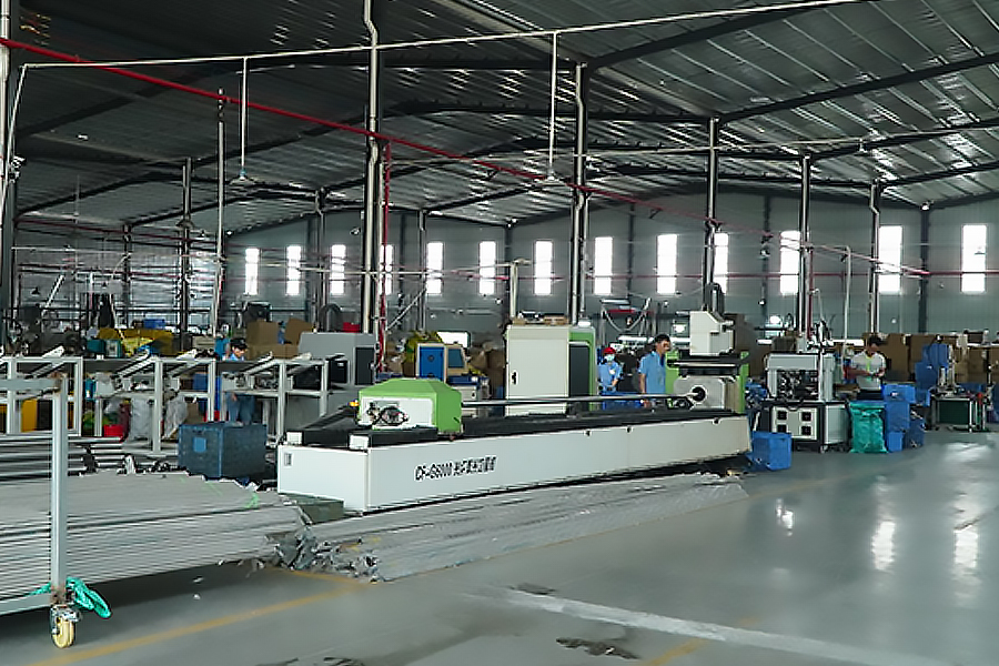 Image of the production workshop at Zhongshan Yuekon Electrical Appliances Co., Limited, highlighting the factory environment and workers on the assembly line for Coffee Teapots and Juice Extractors.